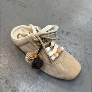 Neutral Beige Lace-Up Women's Sneaker with Decorative Tassel Accents